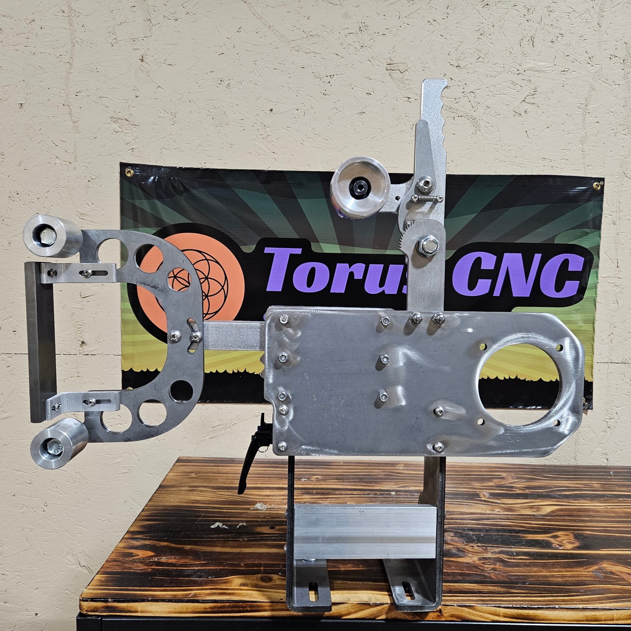 Torus CNC 2x72 belt grinder chassis with tracking and tooling arm.